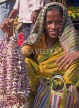 INDIA, West Bengal, Calcutta, Indian woman selling flowers at Malik Ghat, IND1385JPL