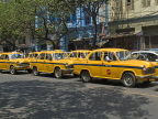 INDIA, West Bengal, Calcutta, fleet of yellow Ambassador taxis in traffic,  IND1381JPL