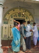 INDIA, West Bengal, Calcutta, pilgrims enter temple, IND1396JPL
