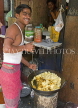 INDIA, West Bengal, Calcutta, roadside food stall, chef smiling, IND1399JPL