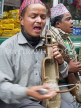 INDIA, West Bengal, Darjeeling, Nepali musician playing traditional instrument, IND1418JPL