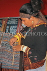 INDONESIA, traditional crafts, Ikat Weaving, weaver with loom at work, INDS1270JPL