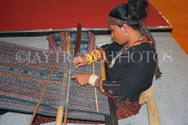 INDONESIA, traditional crafts, Ikat Weaving, weaver with loom at work, INDS1271JPL