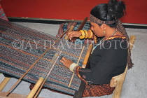 INDONESIA, traditional crafts, Ikat Weaving, weaver with loom at work, INDS1272JPL