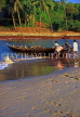 India, GOA, fishermen pulling boat ashore, IND667JPL
