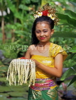Indonesia, BALI, Balinese dancer, holding bowl of floral offerings, BAL533JPL