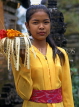 Indonesia, BALI, village girl at temple, with flower offerings, BAL546JPL