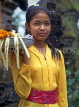 Indonesia, BALI, village girl at temple, with flower orrferings, BAL547JPL
