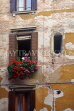 Italy, VENICE, woman at window, and windowbox flowers, ITL1866JPL