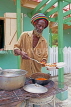 JAMAICA, Montego Bay, Rasta vendor serving takeway food, JM378JPL