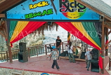 JAMAICA, Negril, Rick's Cafe, singer persforming at bandstand, JM401JPL