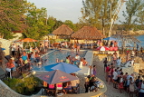 JAMAICA, Negril, Rick's Cafe, tourists around the pool area, JM336JPL