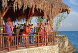 JAMAICA, Negril, Rick's Cafe, tourists by the bandstand, JM337JPL
