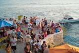 JAMAICA, Negril, Rick's Cafe, tourists by the bar, looking towards sunset, JM350JPL