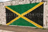 JAMAICA, Negril, old dock, Jamaican flag painted on wall, JM292JPL