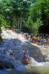 JAMAICA, Ocho Rios, Dunn's River Falls, tourists climbing upstream, JM216JPL