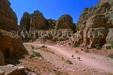 JORDAN, Petra, horsemen riding through canyon, JOR74JPL