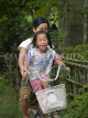 LAOS, Don Khon Island, smiling girls on bicycle, LAO90JPL