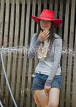 LAOS, Luang Prabang, Songkran Water Festival, Lao girl gettingsprayed, LAO69JPL