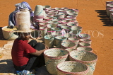MADAGASCAR, Ambalavao, basket seller in market, MDG210JPL