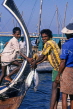 MALDIVE ISLANDS, Male, fishermen unloading catch from dhoni (fishing boat), MAL651JPL
