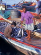 MALDIVE ISLANDS, Male, fishermen with Tuna catch, in Dhoni (fishing boat), MAL554JPL