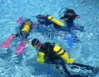 MALDIVE ISLANDS, scuba divers in shalow water, MAL474JPL