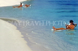 MALDIVE ISLANDS, sunbathers afloat in shallow water, MAL677JPL