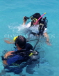 MALDIVE ISLANDS, two scuba divers in shallow water, MAL473JPL