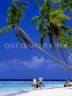 MALDIVE ISLANDS, typical island, couple along beach, leaning coconut trees, MAL717JPL