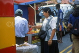 MAURITIUS, Quatre Bornes Market, woman buying fruit, MRU397JPL