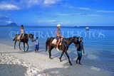MAURITIUS, South Coast, tourists horse riding along beach, MRU341JPL