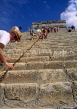 MEXICO, Yucatan, CHICHEN ITZA, people climbing El Castilo Pyramid, MEX73JPL