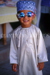 OMAN, Muscat, young boy in traditional dress, wearing sunglasses, OMA113JPL