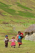 PERU, Chupani, Andean Mountain scenery, Peruvian children walking along, PER84JPL