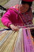 PERU, Chupani, Andean Mountains, traditional textile weaving, woman working with loom, PER89JPL