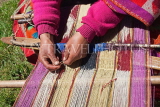 PERU, Chupani, Andean Mountains, traditional textile weaving, woman working with loom, PER90JPL