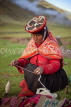 PERU, Chupani, Andean Mountains, traditional weaving, woman spinning yarn, PER43JPL