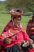 PERU, Chupani, Andean Mountains, traditional weaving, woman spinning yarn, PER61JPL