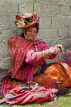 PERU, Chupani, Andean Mountains, traditional weaving, woman spinning yarn, PER63JPL