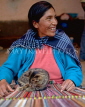 PERU, Parobamba, traditional textile weaving, woman with loom, and cat, PER98JPL