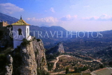 SPAIN, Alicante Province, GUADALEST, church bell tower and mountains, SP160JPL