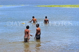 SRI LANKA, Anuradhapura, Basawakkulama tank (Abhaya Wewa), people bathing, SLK5562JPL