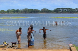 SRI LANKA, Anuradhapura, Basawakkulama tank (Abhaya Wewa), people bathing, SLK5563JPL
