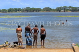 SRI LANKA, Anuradhapura, Basawakkulama tank (Abhaya Wewa), people bathing, SLK5564JPL