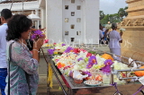 SRI LANKA, Anuradhapura, Ruwanweliseya Dagaba, worshipper at shrine, SLK5731JPL