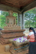 SRI LANKA, Anuradhapura, Samadhi Buddha statue, and worshipper, SLK5709JPL