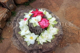 SRI LANKA, Anuradhapura, Thuparamaya Dagaba (stupa) site, lotus flower offerings, SLK5682JPL