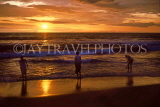 SRI LANKA, Colombo, people paddling on beach, sunset, SLK339JPL