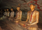 SRI LANKA, Dambulla Cave Temple (Golden Temple), row of seated Buddha statues in cave, SLK2806JPL